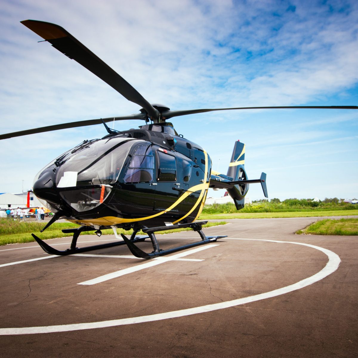 a helicopter parked on the side of a road